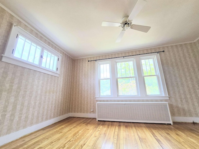 366 S Main St, Concord, NH 03301 - unfurnished room with radiator heating unit, hardwood / wood-style floors, ornamental molding, wallpapered walls, and baseboards