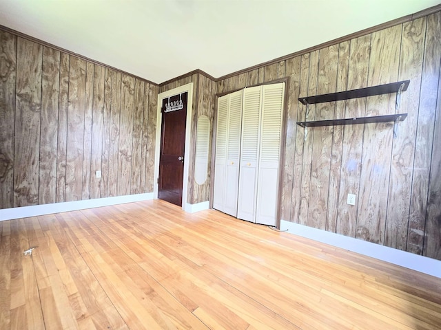 366 S Main St, Concord, NH 03301 - unfurnished bedroom featuring wood finished floors, wooden walls, and baseboards