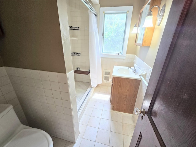 366 S Main St, Concord, NH 03301 - full bath featuring tile patterned floors, a stall shower, vanity, and toilet