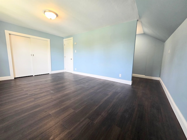 366 S Main St, Concord, NH 03301 - unfurnished bedroom featuring dark wood finished floors, baseboards, vaulted ceiling, and a closet
