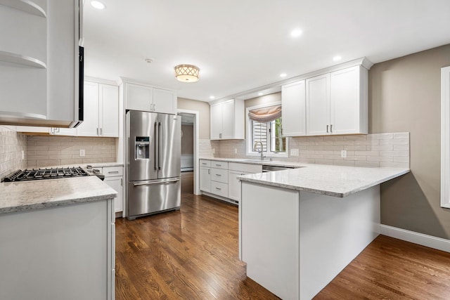 47 Blossom Rd, Windham, NH 03087 - kitchen featuring appliances with stainless steel finishes, a sink, a peninsula, dark wood-type flooring, and open shelves