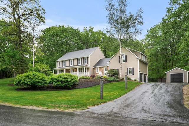 47 Blossom Rd, Windham, NH 03087 - colonial home with a garage, a front lawn, an outbuilding, driveway, and view of wooded area