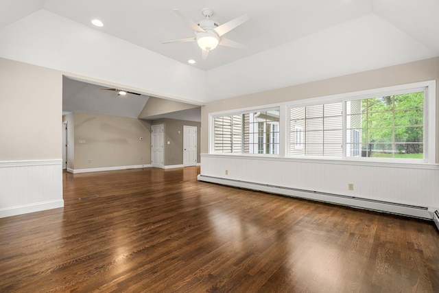 47 Blossom Rd, Windham, NH 03087 - unfurnished living room with vaulted ceiling, a baseboard heating unit, a ceiling fan, wood finished floors, and a wainscoted wall