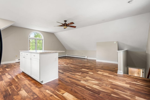 47 Blossom Rd, Windham, NH 03087 - additional living space with wood finished floors, a ceiling fan, vaulted ceiling, a baseboard heating unit, and baseboards