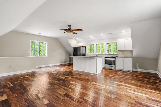 47 Blossom Rd, Windham, NH 03087 - unfurnished living room with wood-type flooring, lofted ceiling, healthy amount of natural light, a ceiling fan, and baseboards