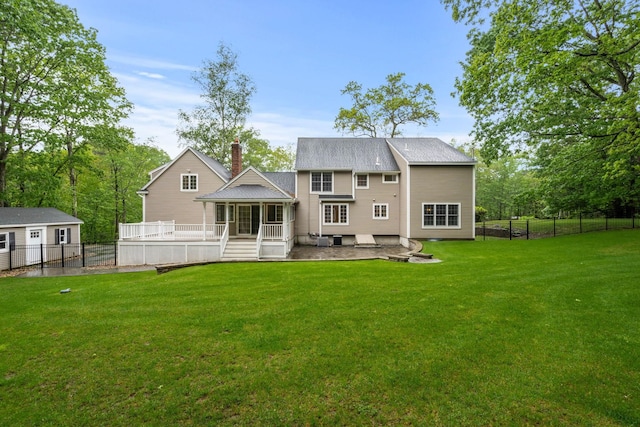 47 Blossom Rd, Windham, NH 03087 - rear view of property with a patio area, a wooden deck, and a chimney