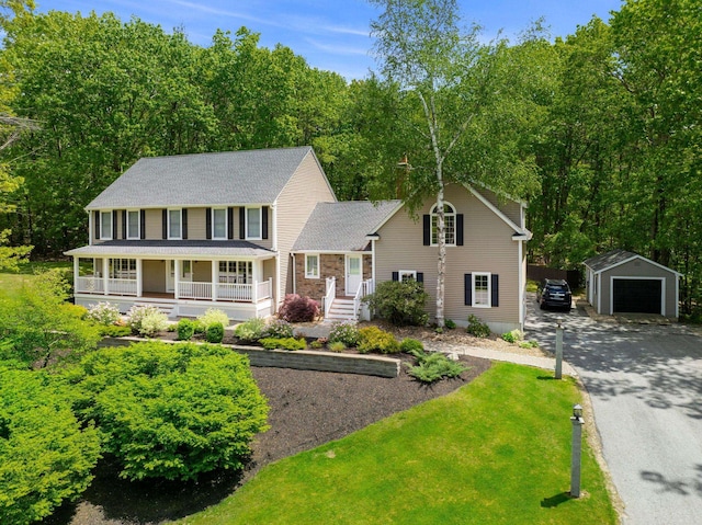 47 Blossom Rd, Windham, NH 03087 - view of front of home with an outdoor structure, a detached garage, a porch, a front yard, and driveway