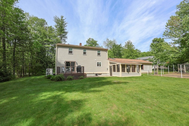 144 Whitten Rd, Milford, NH 03055 - back of property featuring a chimney, a sunroom, a lawn, and a deck