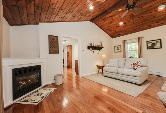 144 Whitten Rd, Milford, NH 03055 - living room with a baseboard heating unit, baseboards, wood finished floors, ceiling fan, and wooden ceiling