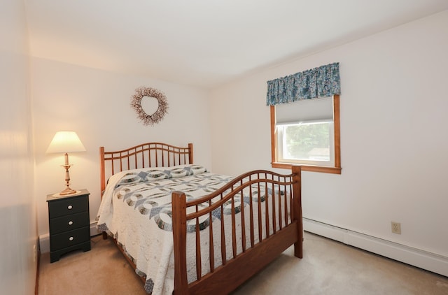 144 Whitten Rd, Milford, NH 03055 - bedroom with a baseboard heating unit and light carpet