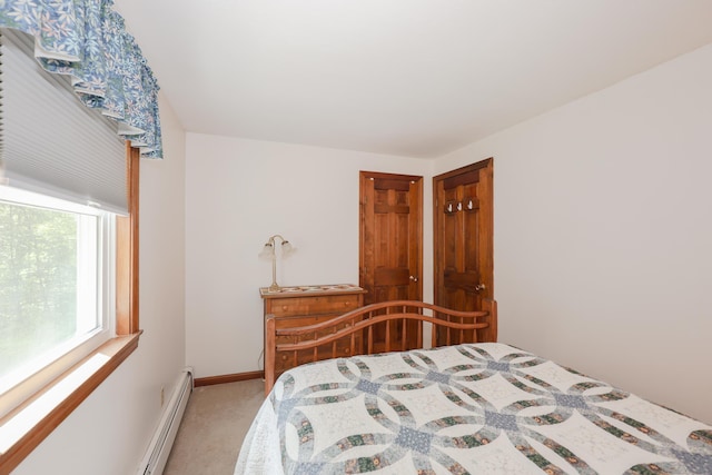 144 Whitten Rd, Milford, NH 03055 - carpeted bedroom with a baseboard heating unit and baseboards
