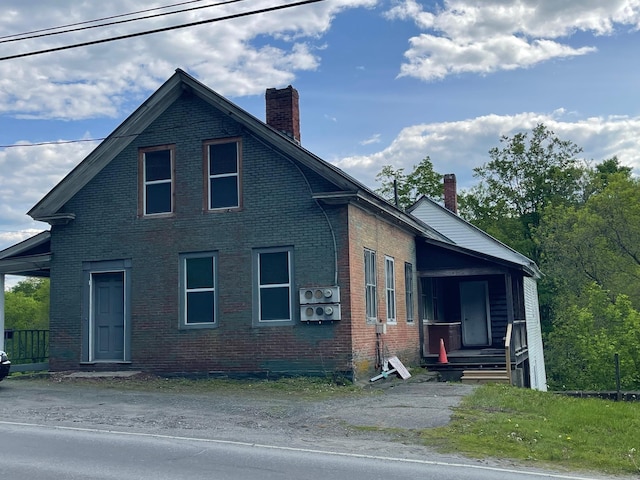 10 Park St, Randolph, VT 05060 - view of front of home featuring a chimney and brick siding
