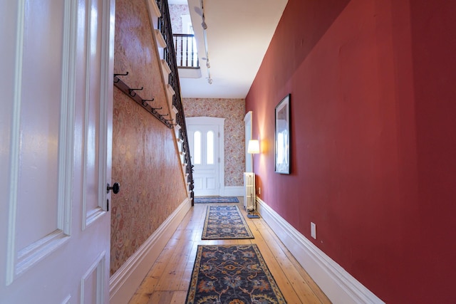 2 Streeter Hill Rd, Chesterfield, NH 03466 - entryway with light wood-type flooring, stairs, wallpapered walls, baseboards, and radiator heating unit