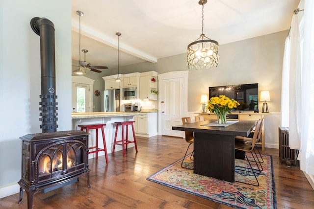 2 Streeter Hill Rd, Chesterfield, NH 03466 - dining area featuring a wood stove, a ceiling fan, dark wood-style floors, beamed ceiling, and a chandelier
