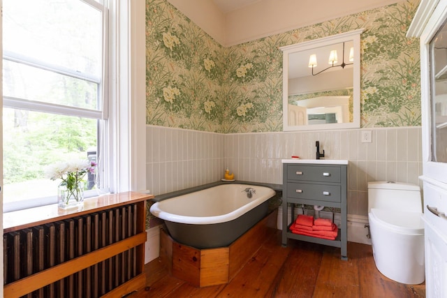 2 Streeter Hill Rd, Chesterfield, NH 03466 - full bathroom featuring wallpapered walls, a freestanding tub, hardwood / wood-style floors, wainscoting, and tile walls