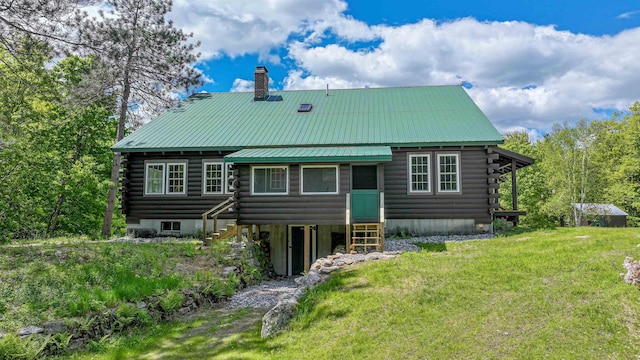 689 Hard Scrabble Rd, Sweden, ME 04008 - back of house featuring log siding, a chimney, metal roof, and entry steps