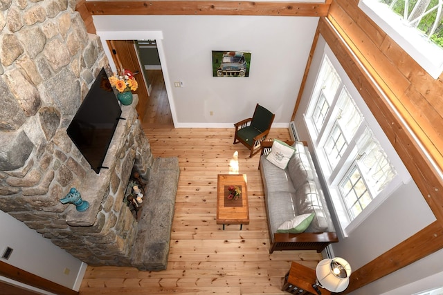 689 Hard Scrabble Rd, Sweden, ME 04008 - living area with healthy amount of natural light, baseboards, and wood finished floors