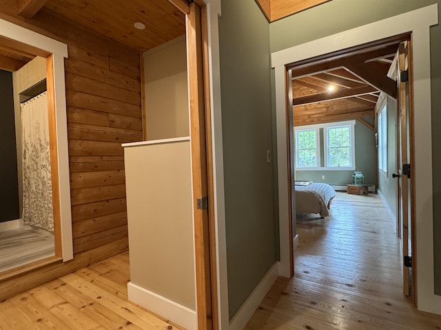 689 Hard Scrabble Rd, Sweden, ME 04008 - corridor with light wood-style flooring, wood walls, and wooden ceiling