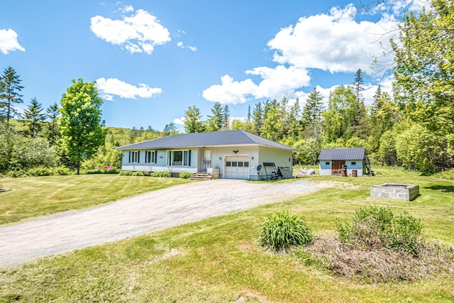 1351 Bobbin Mill Rd, Lunenburg, VT 05906 - ranch-style home featuring a garage, driveway, metal roof, and a front yard