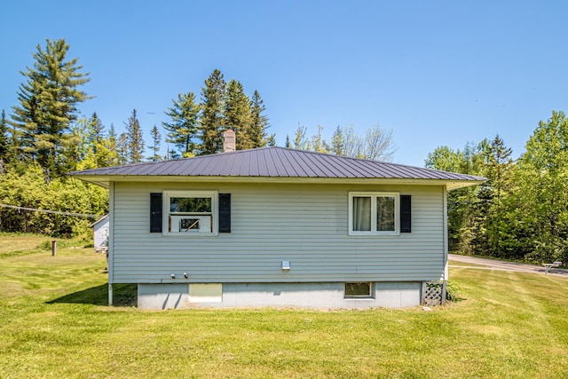 1351 Bobbin Mill Rd, Lunenburg, VT 05906 - view of side of property with a yard and metal roof