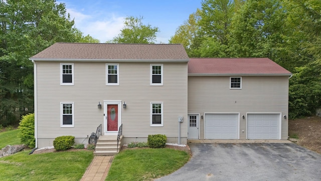 64 Meadowlark Ln, Goffstown, NH 03045 - colonial inspired home with driveway, an attached garage, and a front yard