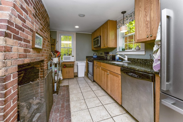 31 Main St, Sandown, NH 03873 - kitchen with appliances with stainless steel finishes, a sink, dark stone countertops, decorative light fixtures, and brown cabinets