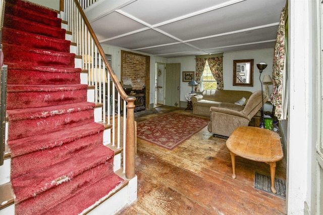 31 Main St, Sandown, NH 03873 - living room with wood finished floors, stairway, and a fireplace