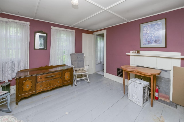 31 Main St, Sandown, NH 03873 - sitting room with healthy amount of natural light, crown molding, and light wood-style flooring