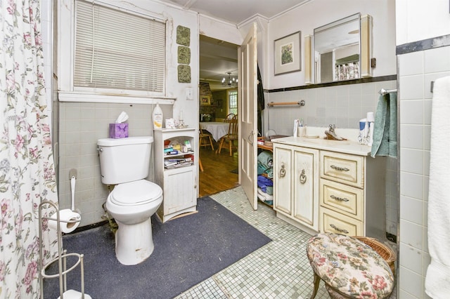 31 Main St, Sandown, NH 03873 - full bath with tile walls, toilet, vanity, tile patterned flooring, and a wainscoted wall