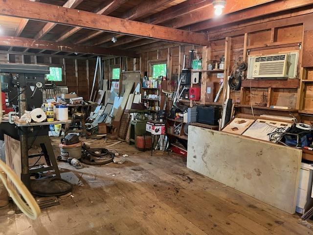 31 Main St, Sandown, NH 03873 - below grade area with a workshop area and a wall mounted air conditioner
