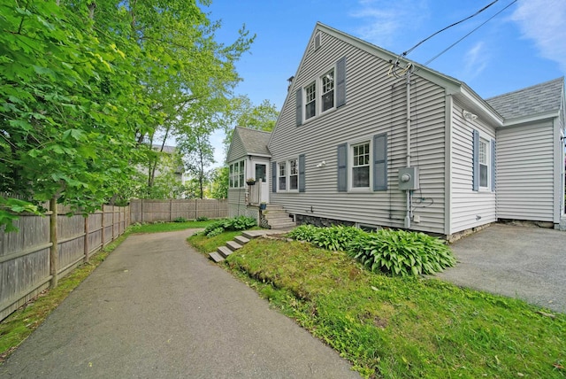 16 Ann Ave, Salem, NH 03079 - view of front of home featuring a shingled roof and asphalt driveway