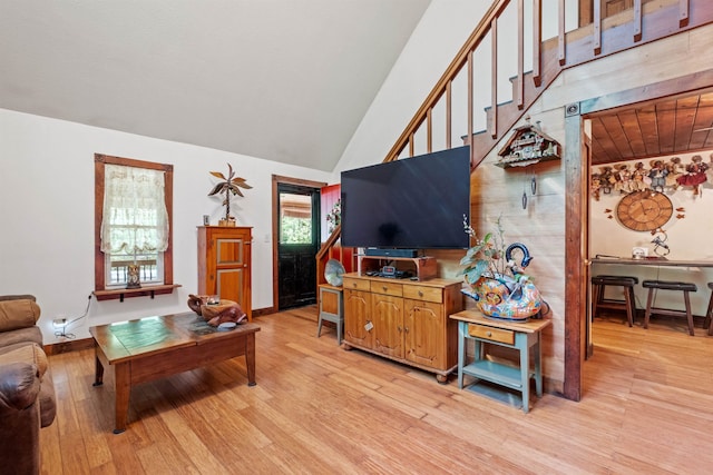 72 Beaver Rd, Strafford, NH 03884 - living room with light wood finished floors, high vaulted ceiling, and baseboards