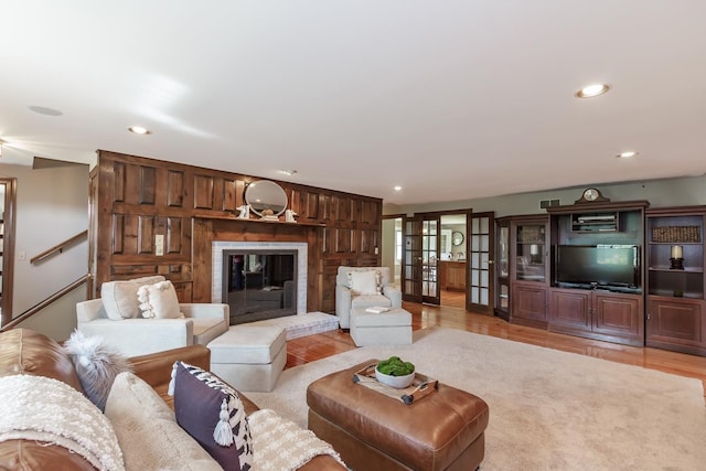19 Cambridge Rd, Hampstead, NH 03841 - living room with light wood finished floors, recessed lighting, and stairway