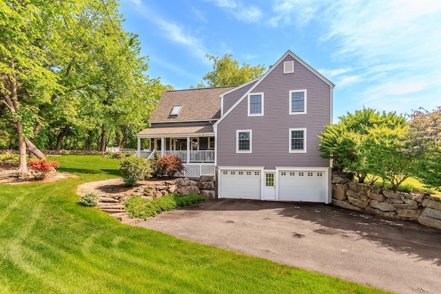 19 Cambridge Rd, Hampstead, NH 03841 - back of house with driveway, an attached garage, covered porch, a lawn, and roof with shingles