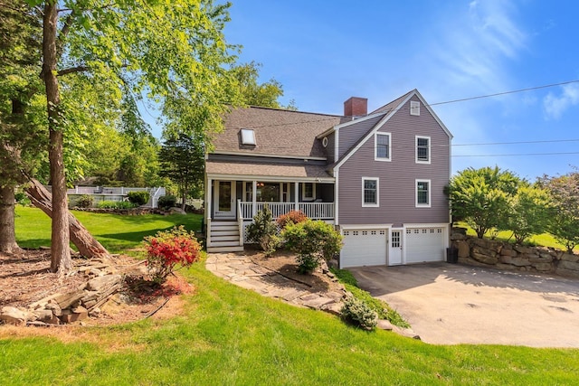 19 Cambridge Rd, Hampstead, NH 03841 - rear view of house with an attached garage, driveway, a chimney, a lawn, and covered porch