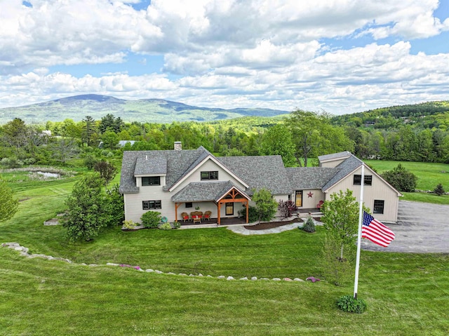 93 Rowell Hill Rd, New London, NH 03257 - view of front of property with a chimney, a front lawn, and a mountain view