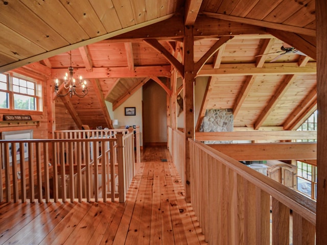 93 Rowell Hill Rd, New London, NH 03257 - corridor featuring wood ceiling, an upstairs landing, a chandelier, light wood-style flooring, and healthy amount of natural light