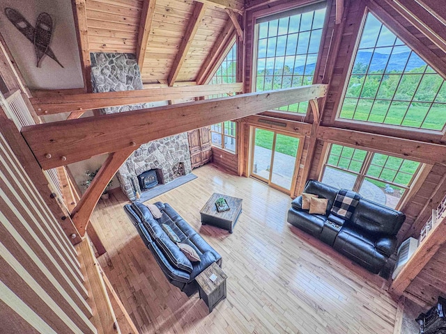93 Rowell Hill Rd, New London, NH 03257 - living room featuring wooden ceiling with exposed beams, high vaulted ceiling, hardwood / wood-style flooring, and wood walls