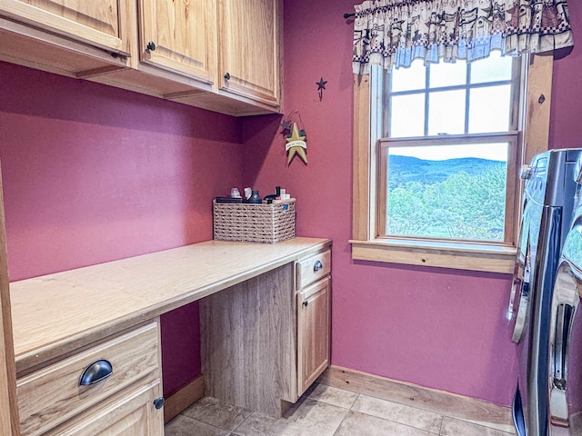 93 Rowell Hill Rd, New London, NH 03257 - laundry room featuring cabinet space, healthy amount of natural light, a desk, and separate washer and dryer
