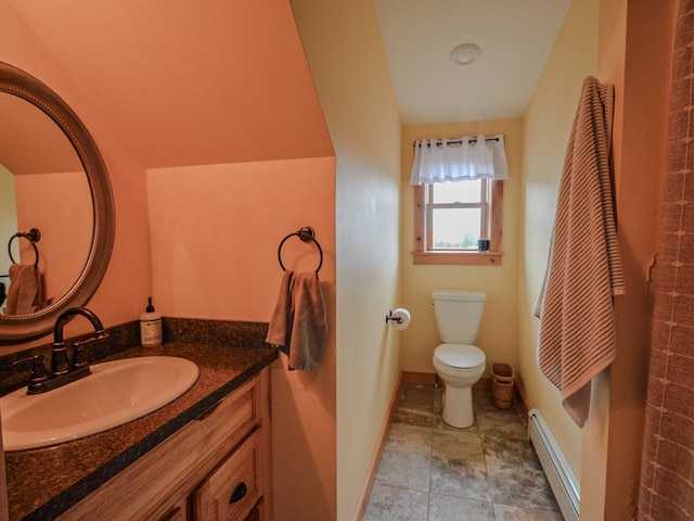 93 Rowell Hill Rd, New London, NH 03257 - bathroom featuring a baseboard radiator, vanity, toilet, and baseboards