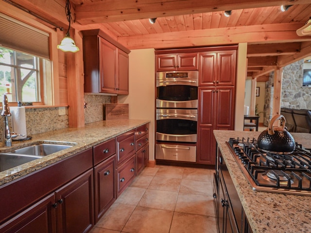 93 Rowell Hill Rd, New London, NH 03257 - kitchen with a warming drawer, stainless steel appliances, a sink, decorative backsplash, and hanging light fixtures