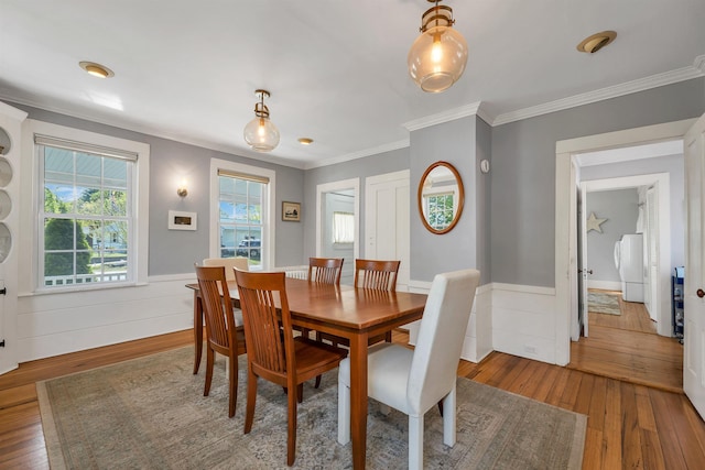 92 Mace Rd, Hampton, NH 03842 - dining room with hardwood / wood-style flooring, ornamental molding, wainscoting, and washer / dryer