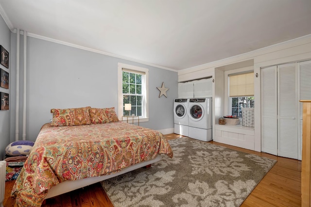 92 Mace Rd, Hampton, NH 03842 - bedroom with washing machine and dryer, crown molding, wood finished floors, and baseboards