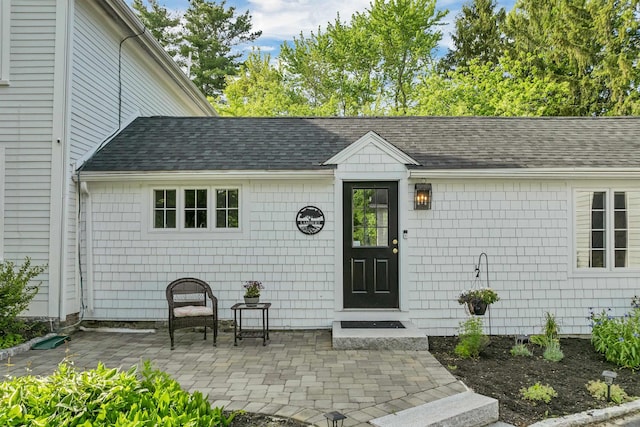 92 Mace Rd, Hampton, NH 03842 - property entrance with a patio area and roof with shingles
