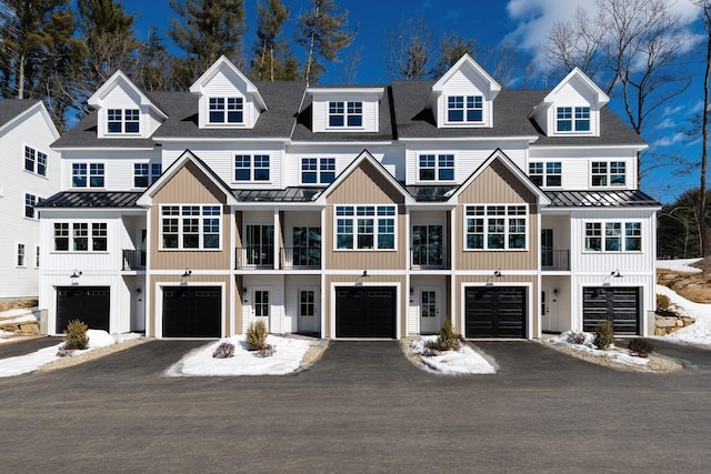 60 White Oaks Rd Unit 26, Laconia, NH 03246 - townhome / multi-family property with a standing seam roof, metal roof, driveway, board and batten siding, and a garage