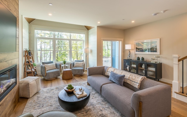 60 White Oaks Rd Unit 26, Laconia, NH 03246 - living room with wood finished floors, a fireplace, and recessed lighting