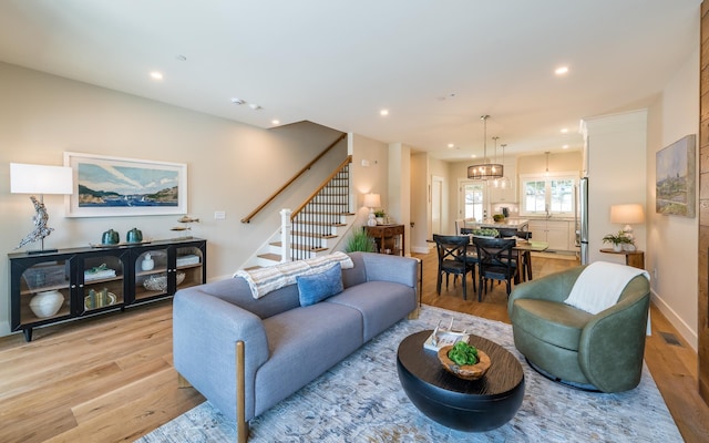 60 White Oaks Rd Unit 26, Laconia, NH 03246 - living room featuring light wood-style flooring, stairs, and recessed lighting