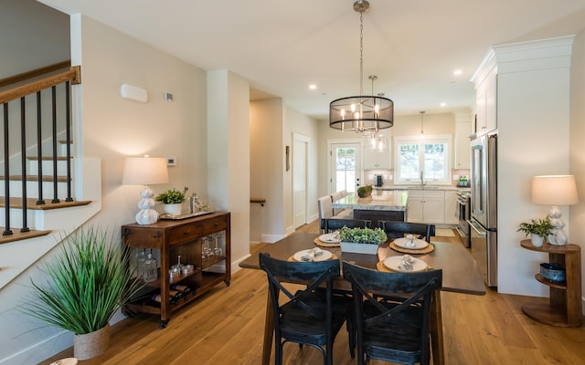 60 White Oaks Rd Unit 26, Laconia, NH 03246 - dining space with stairs, light wood-style flooring, and recessed lighting