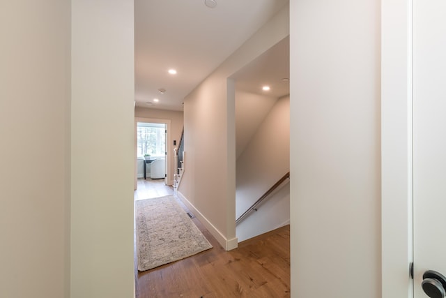 60 White Oaks Rd Unit 26, Laconia, NH 03246 - hallway featuring an upstairs landing, light wood-type flooring, recessed lighting, and baseboards