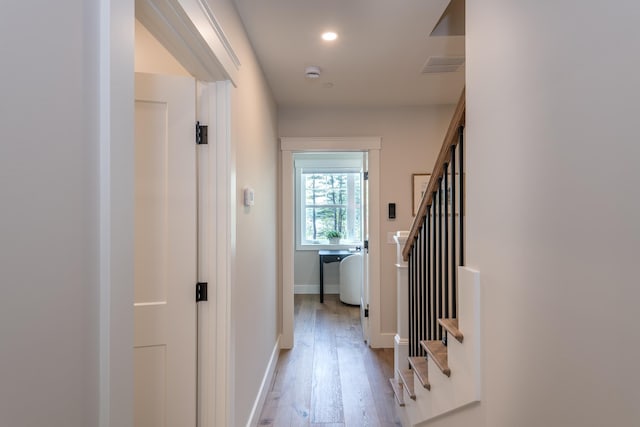 60 White Oaks Rd Unit 26, Laconia, NH 03246 - corridor with light wood-style flooring, stairway, baseboards, and recessed lighting